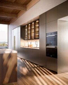 Premium modular kitchen design with built-in appliances and glass cabinets.